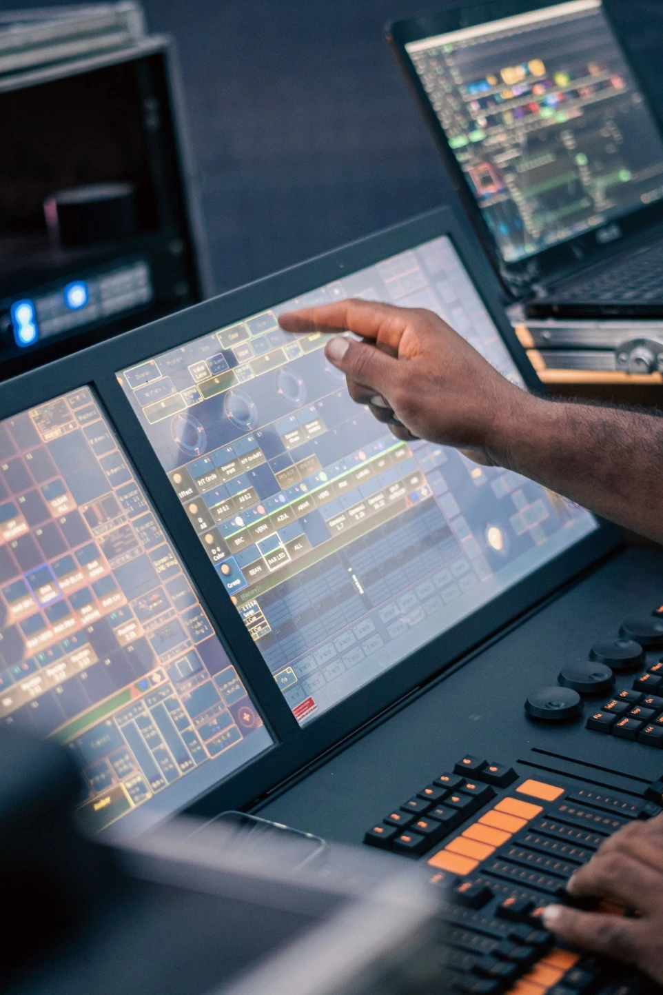 alt="Operator monitoring an industrial control room"